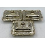 A set of three silver, hallmarked lidded small butter dishes, Birmingham 1935 by A Marston & Co (