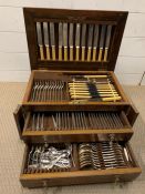 A canteen of cutlery in an oak case