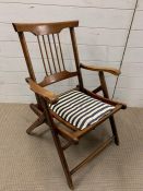 A vintage oak folding chair