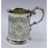 A silver tankard, engraved, hallmarked Sheffield 1864. Makers name Henry Wilkinson & Co. (129g)