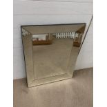 A wall mirror with mirrored frame sides (90cm x 70cm)