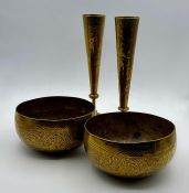 A pair of brass bowls and candlesticks.