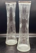 A pair of silver rimmed cut glass vases