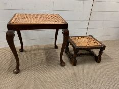 A mahogany caned seat stool and a low oak caned foot rest or stool