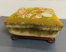 A mahogany tapestry Regency footstool with a sarcophagus shape