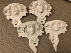 Four decorative wall mounted planters in the style of a goddess.