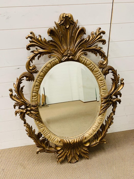A 20th century giltwood oval mirror with floral carving - Image 2 of 7