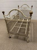 An early child's dolls cot with brass knobs to ends and castors (H40cm W56cm W32cm)