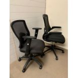 A pair of office chairs