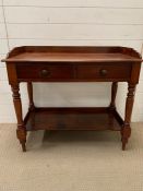 A mahogany wash stand with two drawers to centre (H82cm W90cm D45cm)