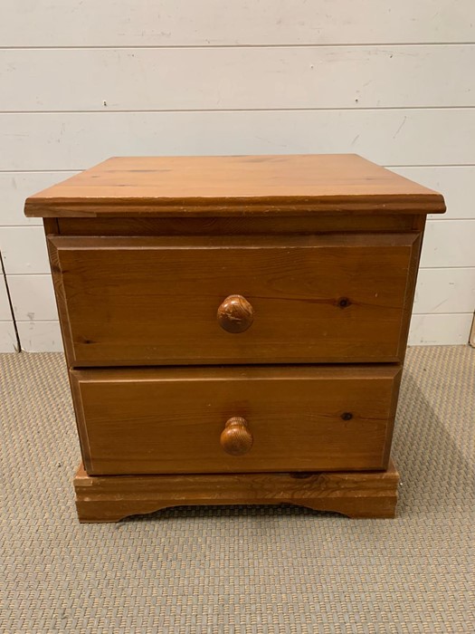 A pine two drawer bedside AF (H52cm W51cm D45cm)