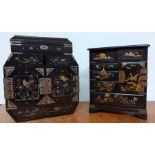 A pair of early 20th century Japanese black lacquered table cabinets, with gilt and mother of