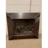 An oak frame with cast inset wall hanging picture with fleur de lis to corner (H77cm W88cm)