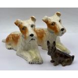 Three terrier figures, one by Royal Doulton