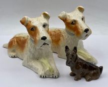 Three terrier figures, one by Royal Doulton