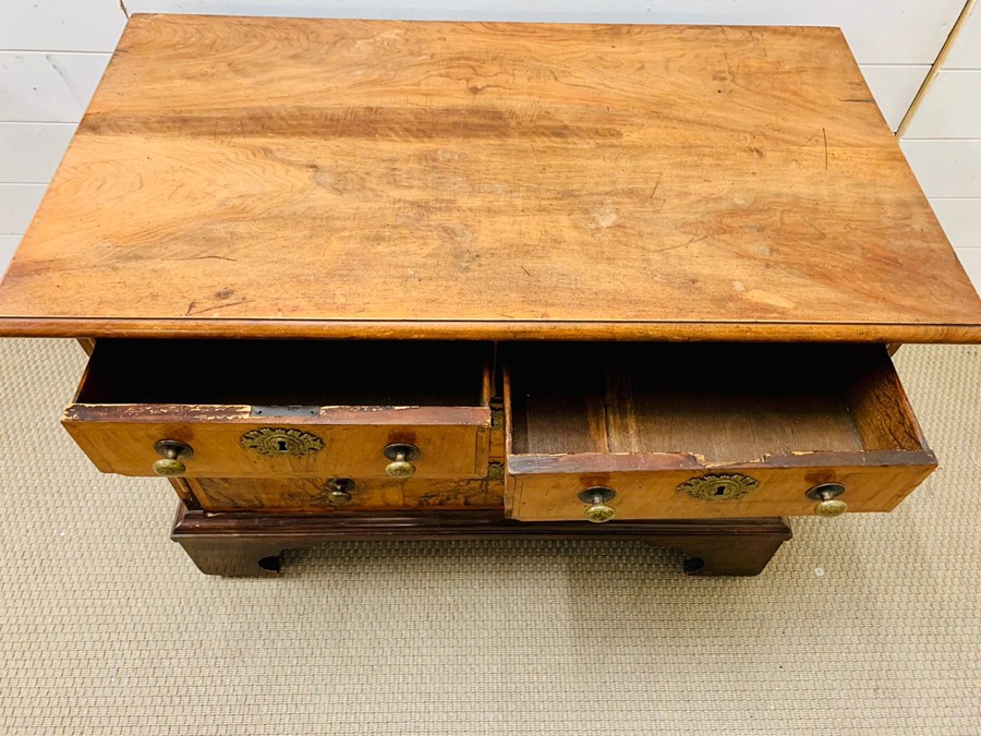 A walnut chest of two over two drawers on a bracket feet base (H72cm W98cm D54cm) - Image 3 of 5