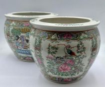 A pair of two small Chinese fish bowls
