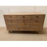 A contemporary lime oak sideboard by Hudson Living (H80cm W140cm D49cm)