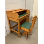 A vintage children's roll top desk and matching chair by Taylor England (H80cm W70cm D44cm)