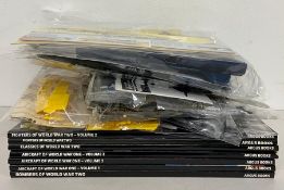 A selection of six model aircraft kits, Cessna, Tiger Shark, etc and seven books of Aircraft Archive