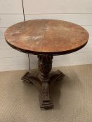 A mahogany side table with carved centre support (H69cm Dia60cm)