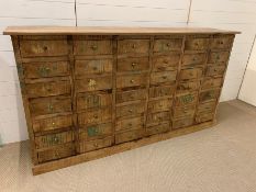 A large apothecary style chest of drawers (H106cm W198cm D41cm)