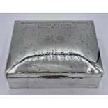 A Hallmarked silver engraved cigarette box.