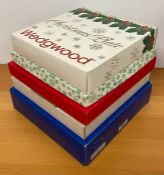 Five boxed Christmas themed plates, including those from Coalport, Royal Worcester, Wedgwood and