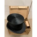 A top hat in box by Dunn and Co