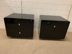 A pair of black lacquer bedsides (H47cm W56cm D42cm)