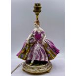 A porcelain figure of a lady lamp base.