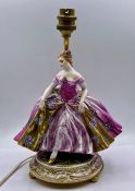 A porcelain figure of a lady lamp base.