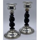 A Pair of silver and ebonised twisted candlesticks, hallmarked for Chester 1927, makers mark for