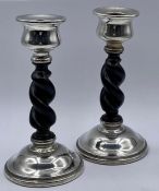 A Pair of silver and ebonised twisted candlesticks, hallmarked for Chester 1927, makers mark for