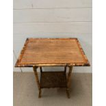 A cane side table with shelf under (H73cm W56cm D40cm)