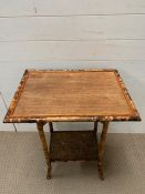 A cane side table with shelf under (H73cm W56cm D40cm)