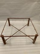 A metal frame coffee table with twisted iron work to legs and cross stretcher (H43cm 103cmsq)