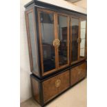 A reproduction lacquered effect Oriental glazed bookcase or display case with brass plate handles