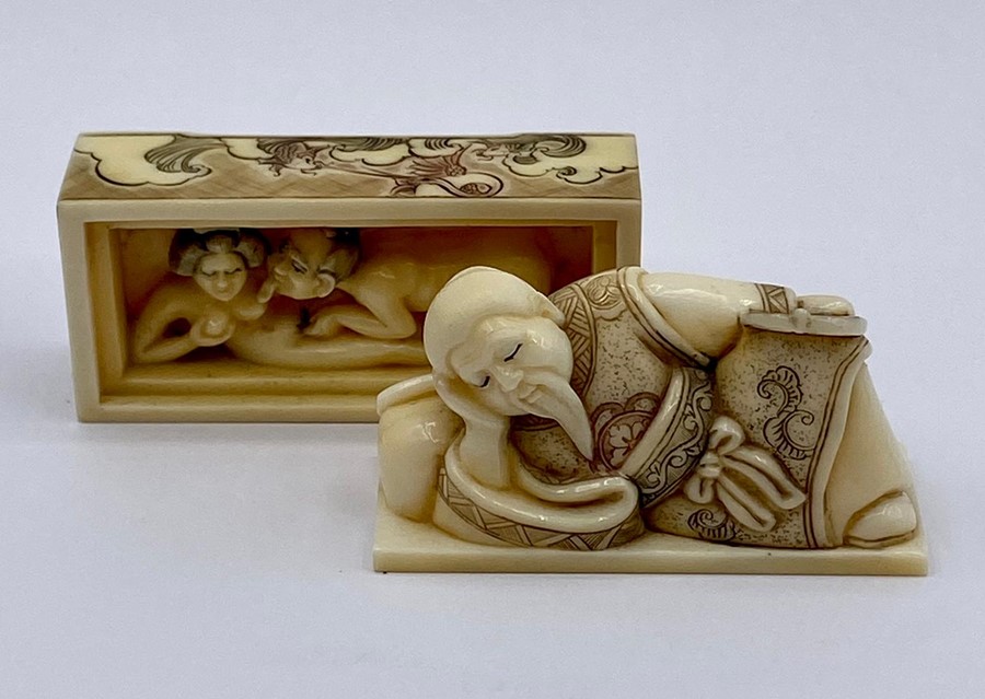 A carved and decorated erotic Japanese netsuke