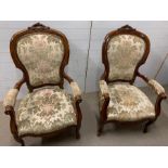 A pair of open armchairs on cabriole legs