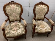 A pair of open armchairs on cabriole legs