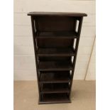 A carved top narrow open shelving unit (H100cm W41cm D19cm)