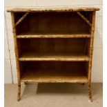 A bamboo and wicker open bookcase (H97cm W82cm D30cm)