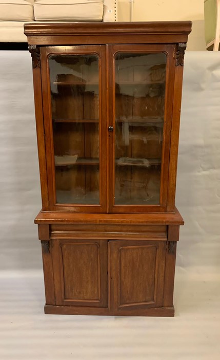 A mahogany glazed bookcase with drawer and cupboard under (H206cm W103cm D39cm)