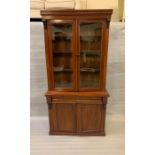 A mahogany glazed bookcase with drawer and cupboard under (H206cm W103cm D39cm)