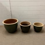 Three green twisted pattern garden pots