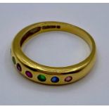 An 18ct gold seven stone ring (Total weight 3.5g) Size K 1/2