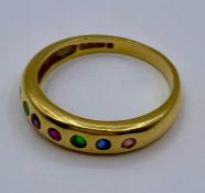 An 18ct gold seven stone ring (Total weight 3.5g) Size K 1/2