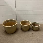 Three glazed garden pots various sizes