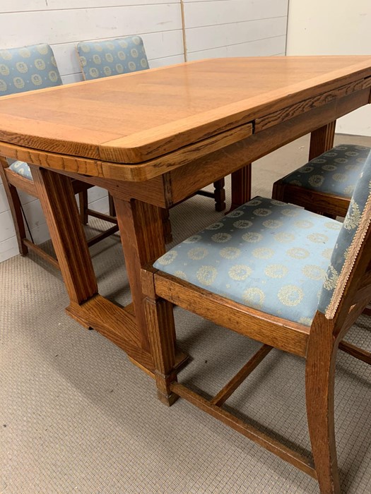 An oak table with reeded legs, extends both sides and four matching chairs (H77cm W126cm D84cm) - Image 2 of 4